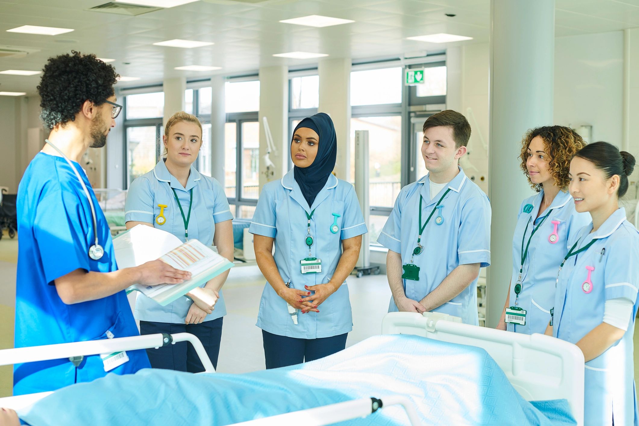 Healthcare team briefing and coaching discussion