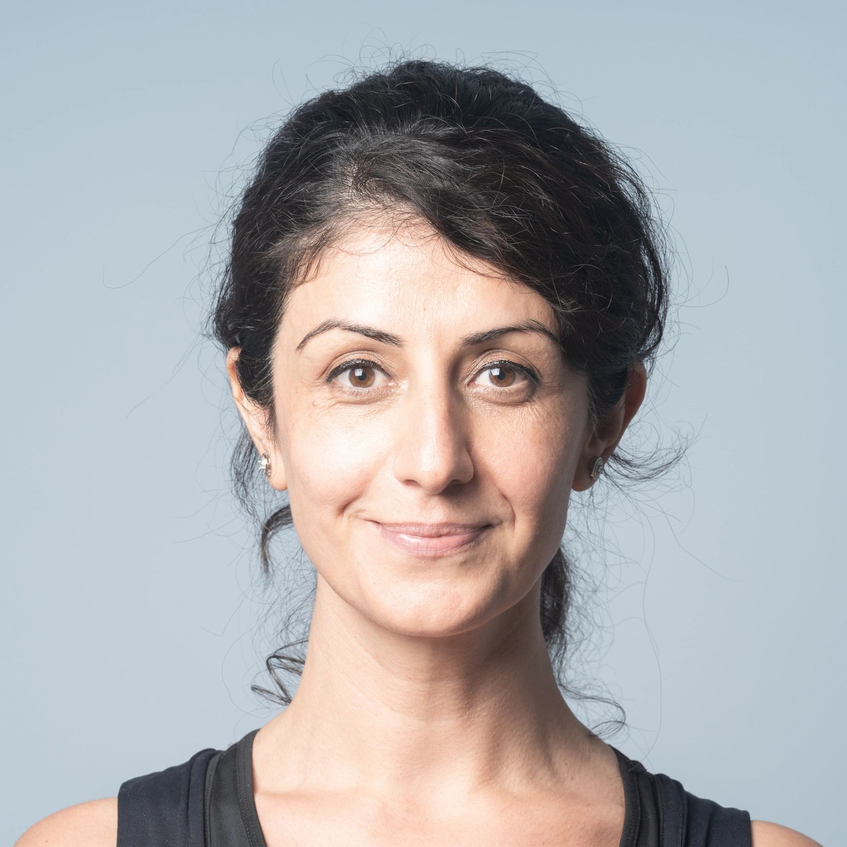 Professional headshot of a confident woman