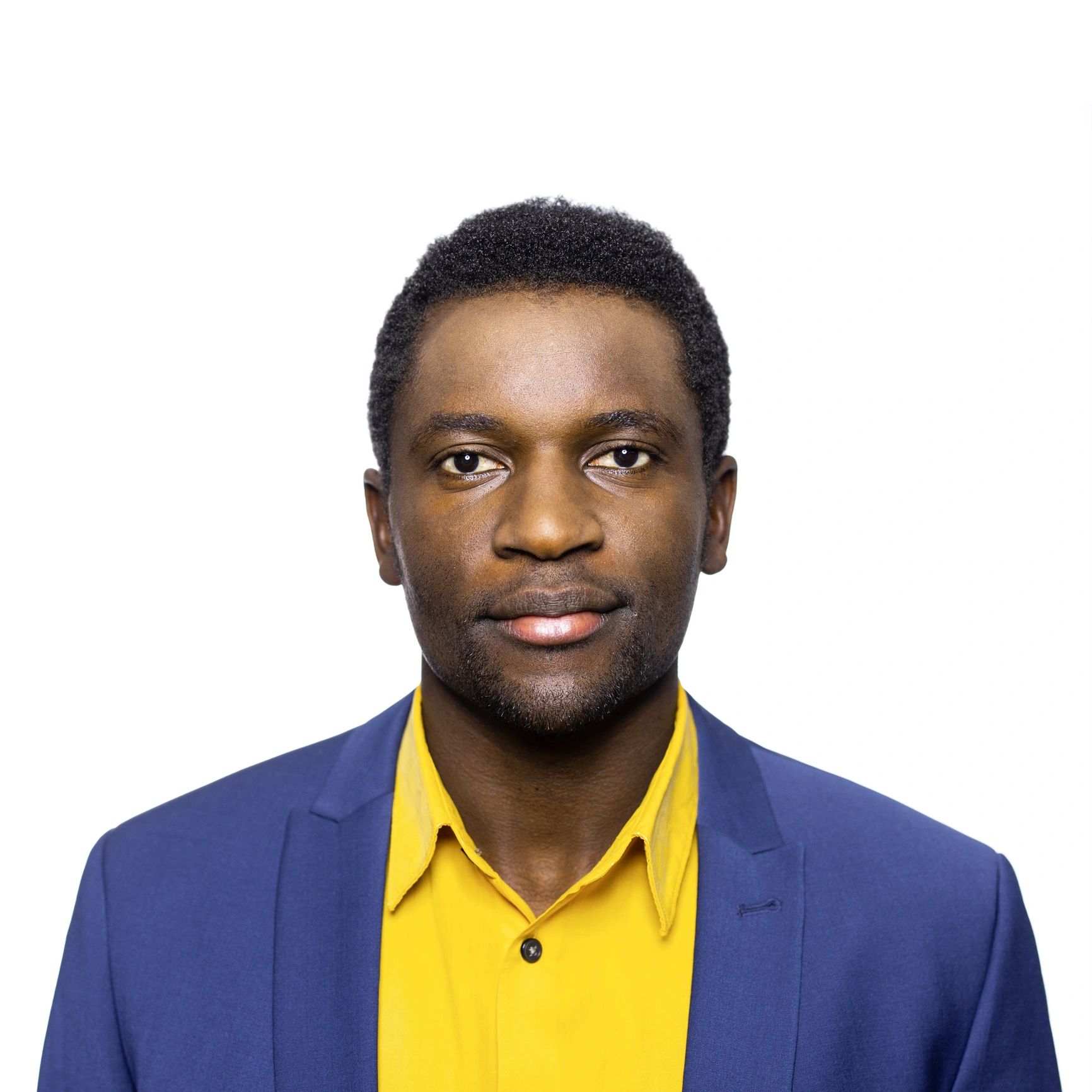 Professional headshot of a smiling man