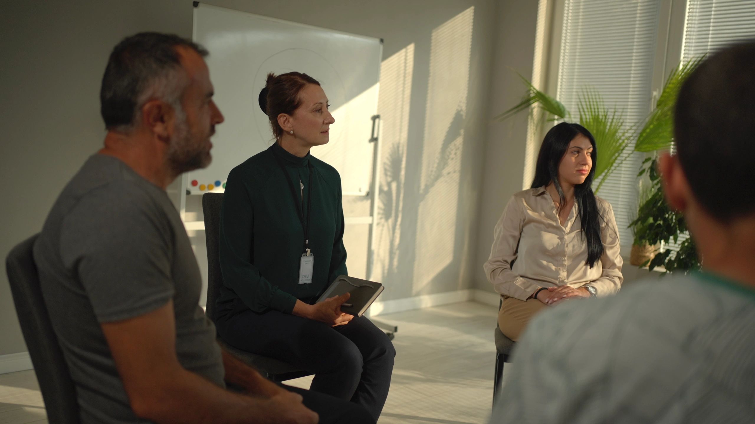 Facilitator leading a wellness workshop with a group